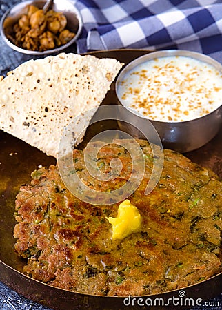 Indian vegetarian meal with pickle papad and yogurt raita Stock Photo