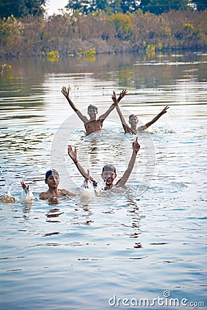Indian village boys swimming in the fresh river water. Editorial Stock Photo