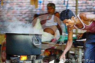 indian villager chef cooking food in traditional style Editorial Stock Photo