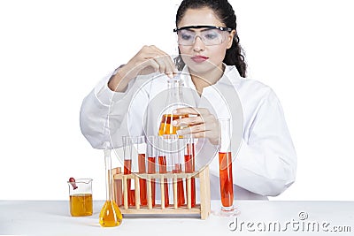 Indian woman doing research with liquid Stock Photo