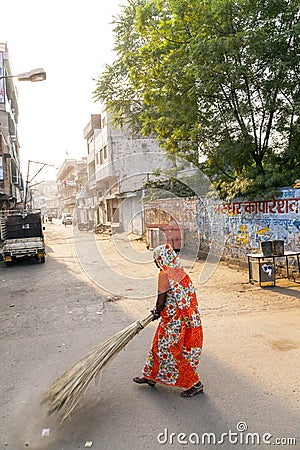 Indian Woman of the fourth Caste cleaning the streets of Jaipur, India Editorial Stock Photo
