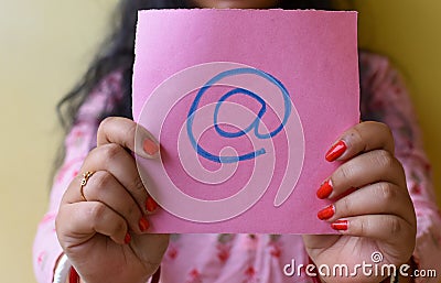 An Indian woman holding email picture icon in hand. Stop spam concept Stock Photo