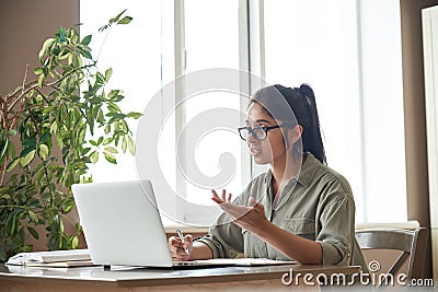 Indian woman online tutor teacher explaining online class zoom video call. Stock Photo