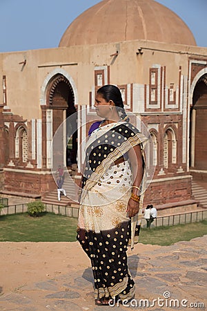 Indian woman walking near Alai gate, Qutub Minar, Delhi, India Editorial Stock Photo
