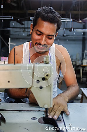 Indian worker sowing Editorial Stock Photo