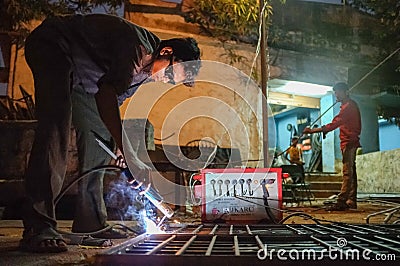 Indian worker welding Editorial Stock Photo