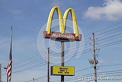 McDonald`s Restaurant. McDonald`s is offering Uber and Door Dash delivery and drive thru service during social distancing Editorial Stock Photo