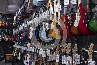 Electric Guitar display at Guitar Center. Selling brands like Fender and Gibson, Guitar Center is a retailer of musical instrument Editorial Stock Photo