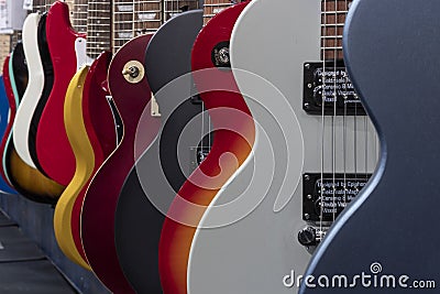 Les Paul and Stratocaster type electric guitar display. Electric guitars have been part of the music scene since the 50s Editorial Stock Photo