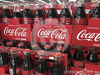 Coca Cola bottle display. Coke products are among the best selling soda pop drinks in the US Editorial Stock Photo