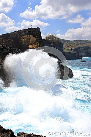 Indic sea waves hitting the cliff rocks at Angelâ€™s Billabong point, an amazing spot close to Broken beach in Nusa Penida Island Stock Photo