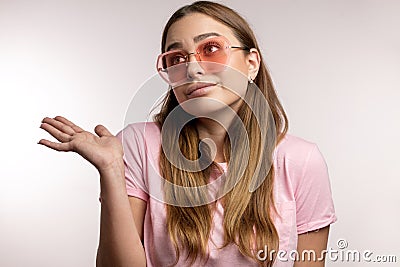 Indifferent awesome woman with raised palm Stock Photo