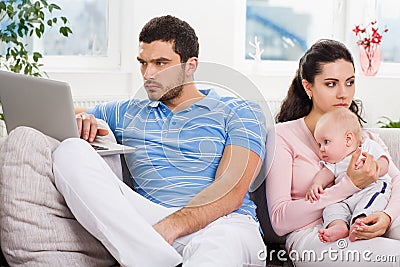 Indifferent father don't looking at his family Stock Photo