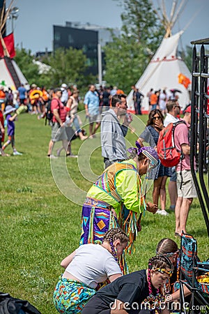 Indigenous dancers preparing for a powwow Editorial Stock Photo