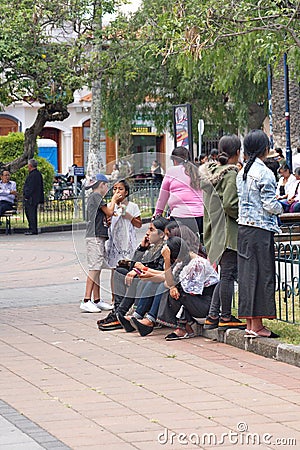 Indigenous people in the park in Cotacachi Editorial Stock Photo