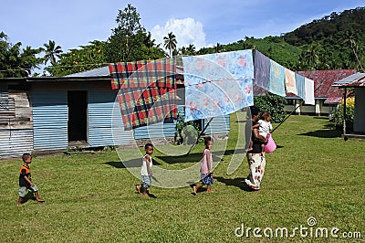 Indigenous Fijian woman and her children in a local village Fiji Editorial Stock Photo