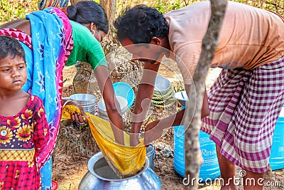 Indigenous people making liquor in desi style from Rotten rice Editorial Stock Photo