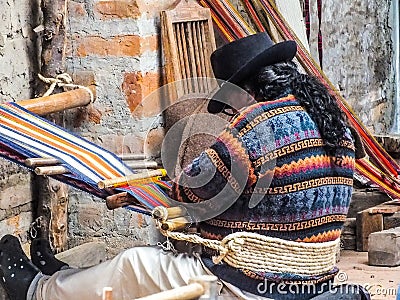 Indigenous Quechua Man Weaving Fabric on a Backstrap Loom Editorial Stock Photo