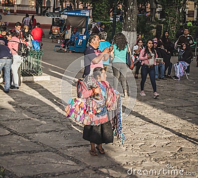 Indigenous woman selling handcrafts in the street of Chiapas Editorial Stock Photo