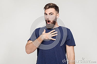 Indignation man looking at camera with shocked face Stock Photo