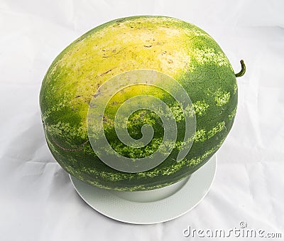 Indispensable fruit of summer months watermelon, waiting for you to be cut with a knife Stock Photo