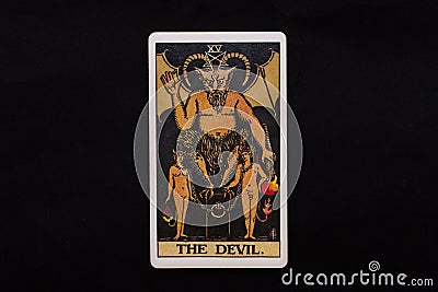 An individual major arcana tarot card isolated on black background. The Devil. Stock Photo