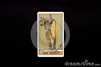 An individual major arcana tarot card isolated on black background. The Hermit. Stock Photo