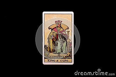 An individual minor arcana tarot card isolated on black background. King of cups. Stock Photo