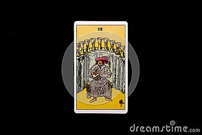 An individual minor arcana tarot card isolated on black background. Nine of cups. Stock Photo