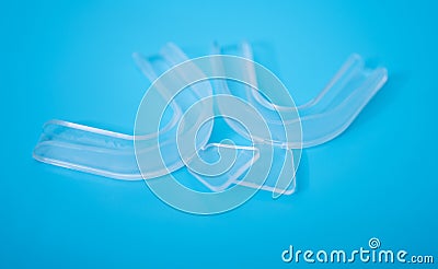 Individual teeth tray for whitening on blue background Stock Photo