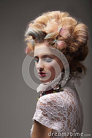 Individuality. Haute Couture. Swanky Woman with Colored Hair Stock Photo