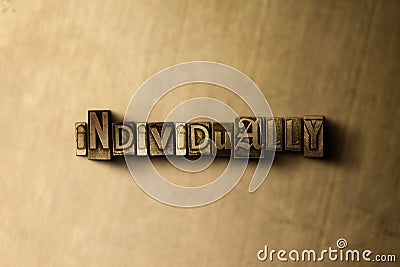 INDIVIDUALLY - close-up of grungy vintage typeset word on metal backdrop Cartoon Illustration