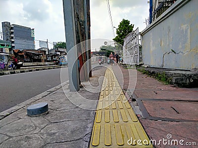 Indomaret, Roxy mas, Jakarta, IndoSidewalks with signposts for the visually impaired with a yellow line Editorial Stock Photo