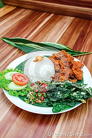 Indonesian, Asian cuisine fried chicken called Ayam Goreng Rempah Sambal Matah spices Stock Photo