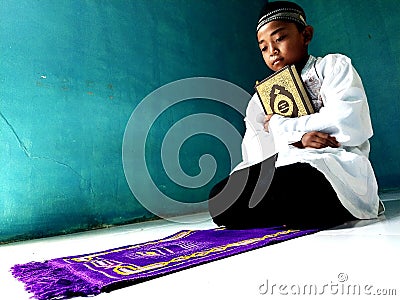 Indonesian Child Holding The Holy Quran Editorial Stock Photo