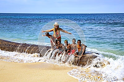 Indonesian funny children in beach Editorial Stock Photo
