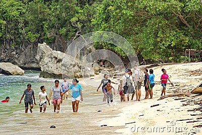 Indonesian funny children on the Pantai Base beach in Sentani, Jayapura Editorial Stock Photo