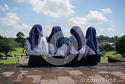 Blitar, East Java, Indonesia, April 15th, 2021 : Indonesian Junior High School student spent a holiday on Penataran Temple, Blitar Editorial Stock Photo