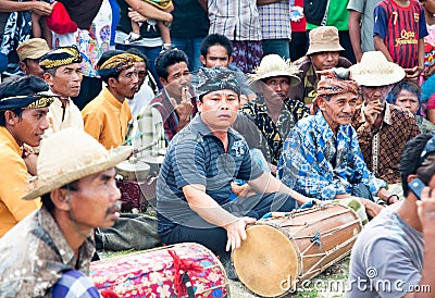Indonesian man is playing drum, Lombok, Idonesia Editorial Stock Photo