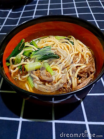 Indonesian typical chicken noodles with vegetables and a savory and delicious broth eaten while still hot Stock Photo