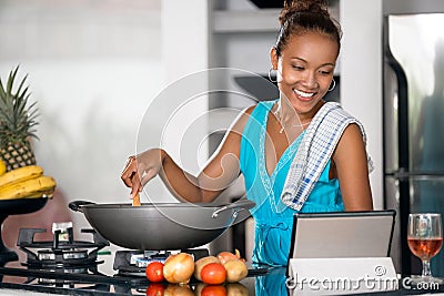 Indonesian woman looking for a recipe on the internet Stock Photo