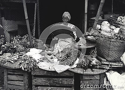 Indonesian woman selling fresh vegetables at the market in Semarang. Film Photography Editorial Stock Photo