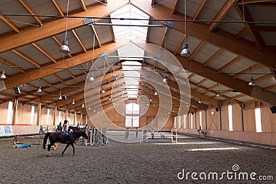 The indoor arena is a special place where horses are trained or trained Stock Photo