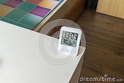 Indoor electronic LCD digital clock with humidity temperature sensor display device Stock Photo