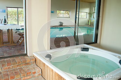 Indoor heated swimming pool and jacuzzi Stock Photo