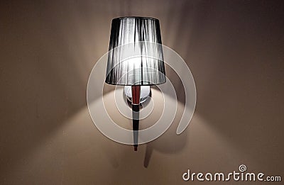 Indoor lighted classic lamp on the wall , vintage lamp Stock Photo