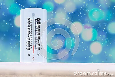 Indoor and Outdoor Thermometer that Shows a very low temperature on Fahrenheit and Celsius with defocus background and falling Stock Photo