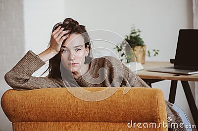 Indoor portrait of beautiful feminine thoughtful young women alone Stock Photo