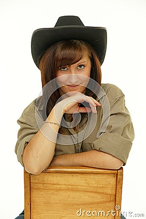 Indoor portrait of beautiful young woman cowgirl Stock Photo