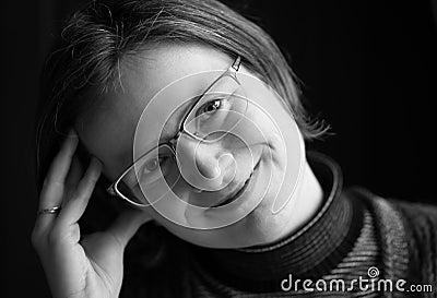 Indoor portrait of a thirty year old beautiful woman with glasses at the Belgian countryside Stock Photo